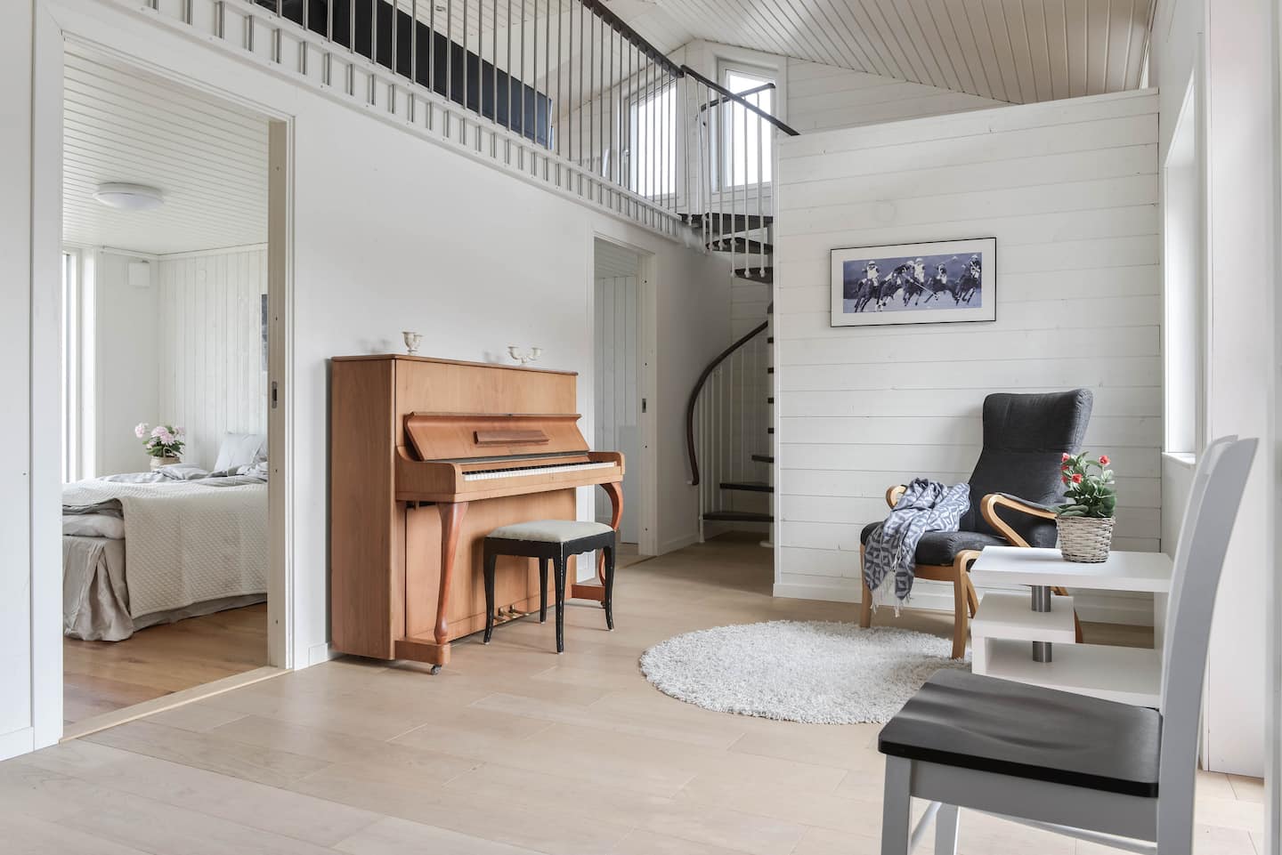Piano and staircase up to the loft