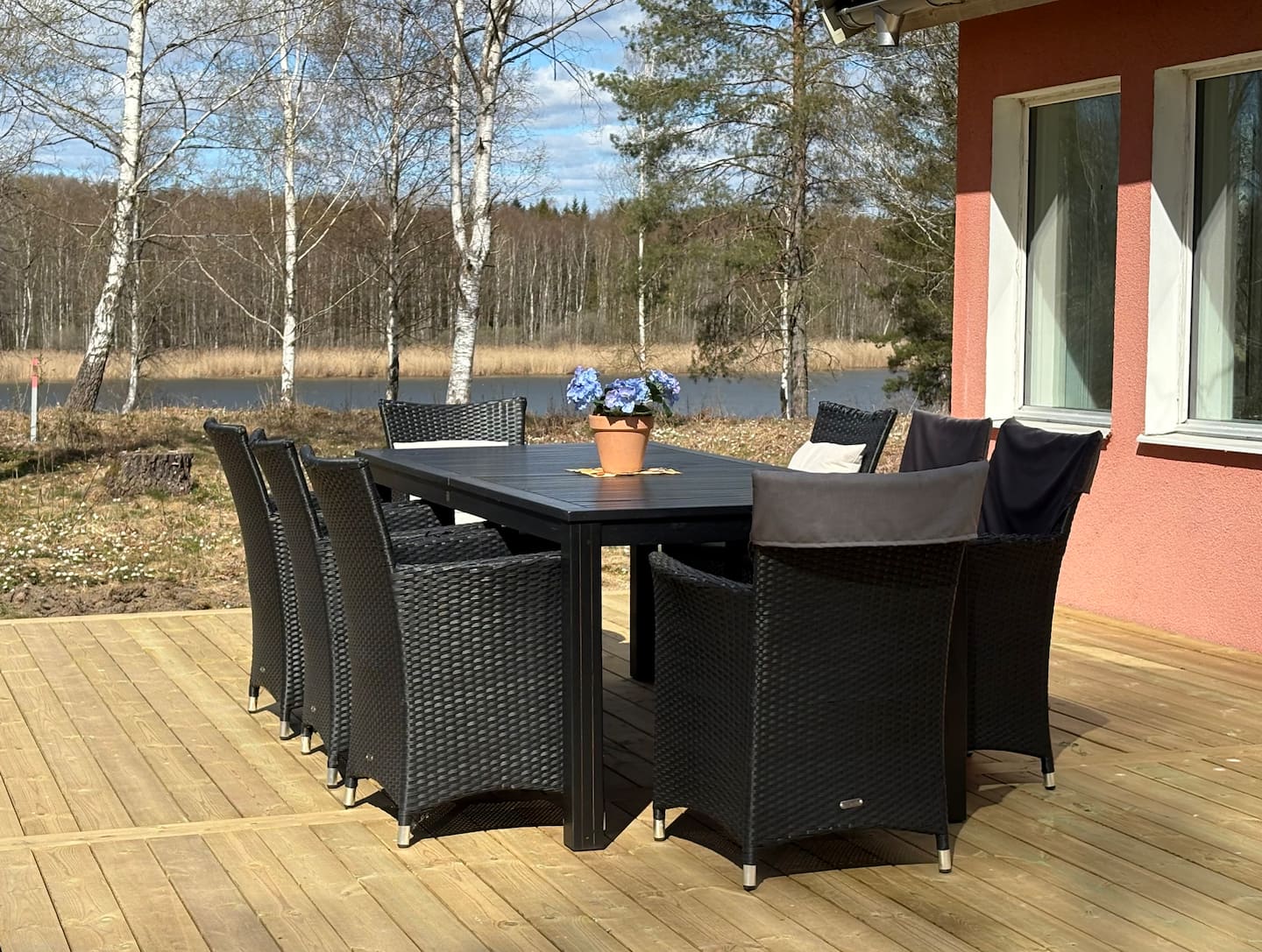 Outdoor dining set on the sunny deck